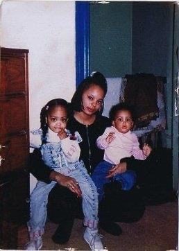 Sonya sitting with two little ones on her lap